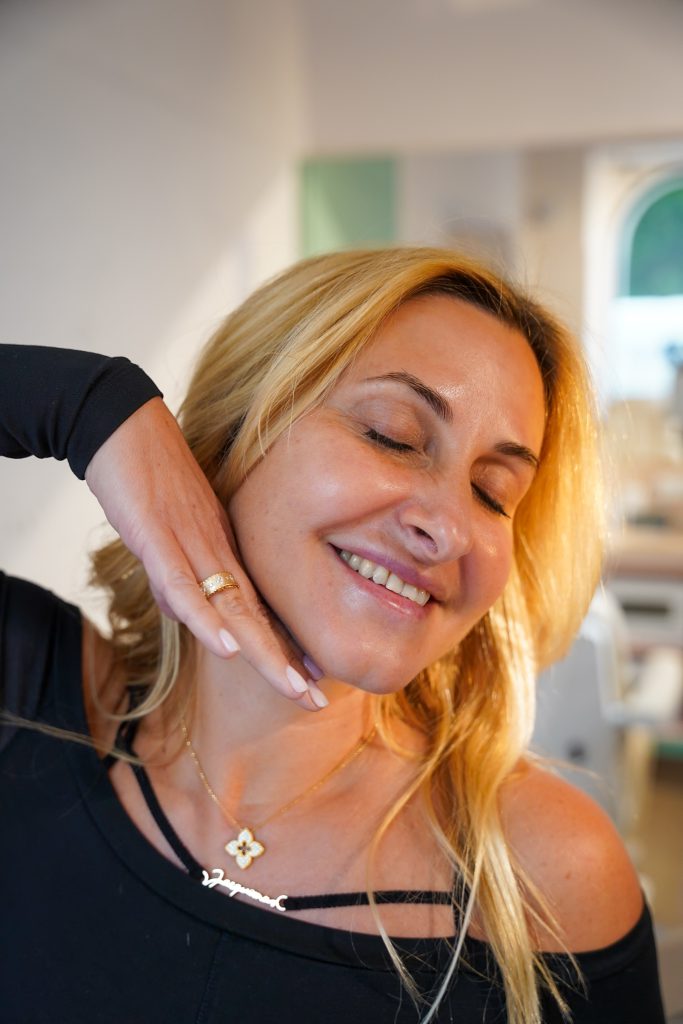Afacialist checking a client's skin – consultation before the signature facial in Vienna